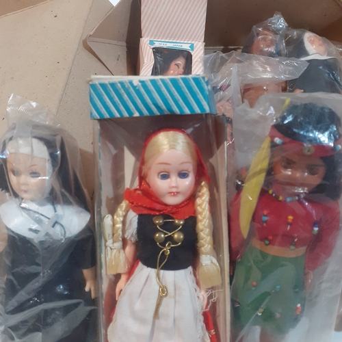19 - Quantity of vintage dolls representing various countries, religions and profession's.  All wrapped i... 