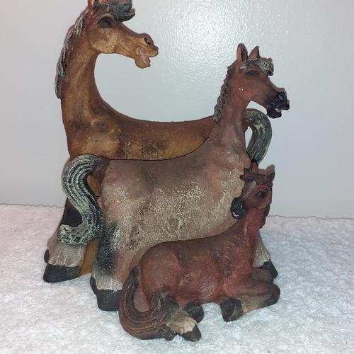 14 - A trio of unusually designed horse ornaments graduating in size that nest into each other.
