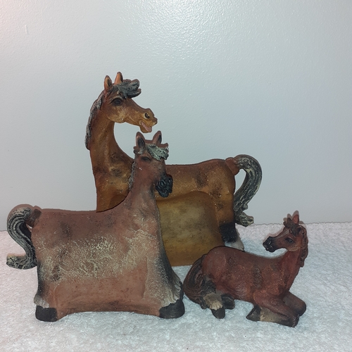 14 - A trio of unusually designed horse ornaments graduating in size that nest into each other.