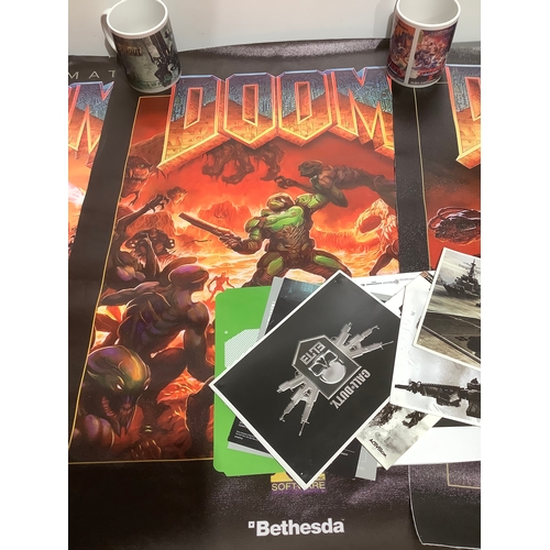 60 - 3x Doom video game canvas, 3 gaming related mugs & Call of Duty limited edition post cards