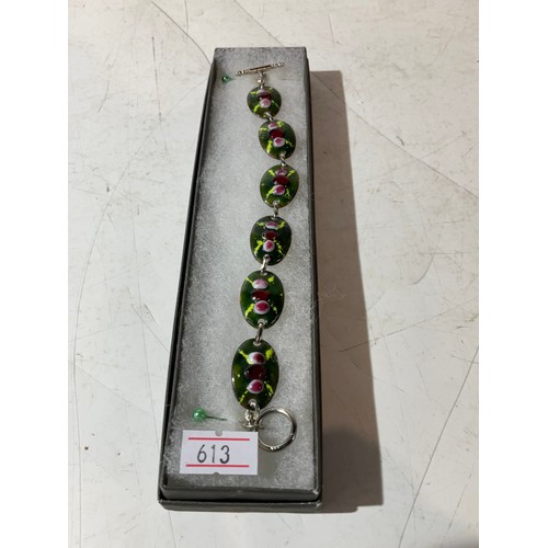 93 - Green hand crafted bracelet with red glass & T bar fastening