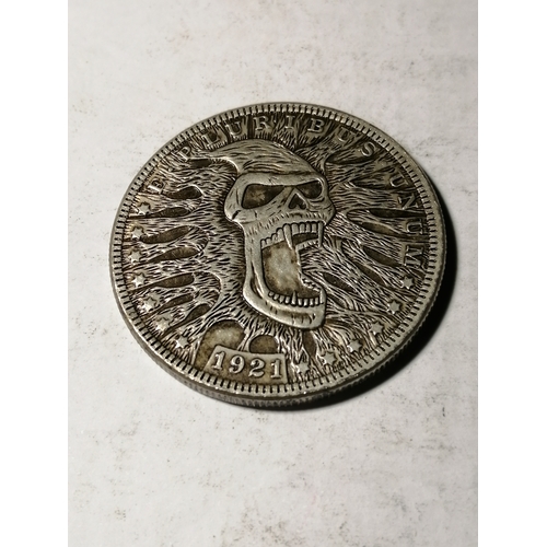 34A - 1921 USA silver dollar with skull design on obverse