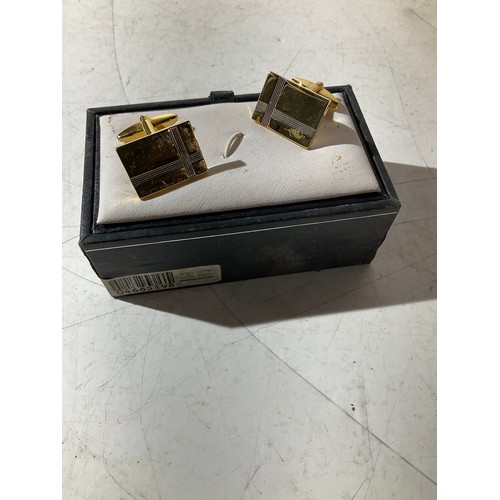 105 - Gold coloured cufflinks in box