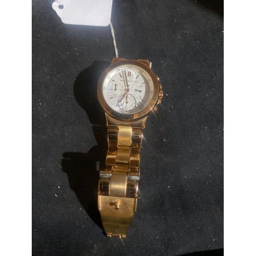 102 - Ladies rose gold Michael Kors watch with new battery fitted