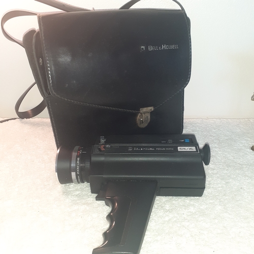 27 - A vintage Bell and Howell focus-matic. Model 674/XL. With original case. Untested but good clean con... 