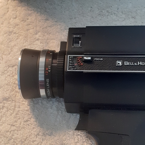27 - A vintage Bell and Howell focus-matic. Model 674/XL. With original case. Untested but good clean con... 
