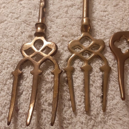 30 - 5 brass toasting forks with decorative handles including a windmill, elephant,  ship and more