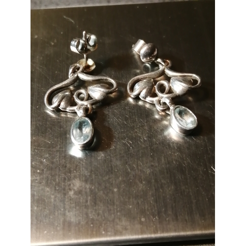 24A - Silver earrings each set with a single light blue gemstone 4.30 grams