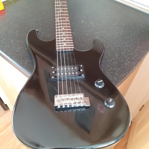 19 - Encore electric guitar in case. Working condition but needs a string replacing