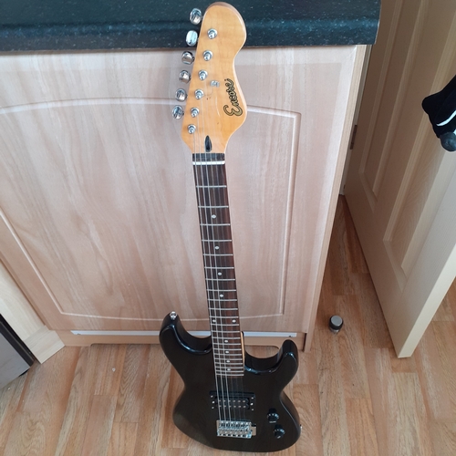 19 - Encore electric guitar in case. Working condition but needs a string replacing