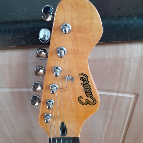 19 - Encore electric guitar in case. Working condition but needs a string replacing