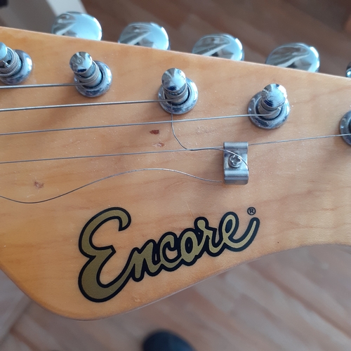 19 - Encore electric guitar in case. Working condition but needs a string replacing