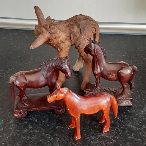 18 - 3 wooden horses and a wooden donkey. No damage.