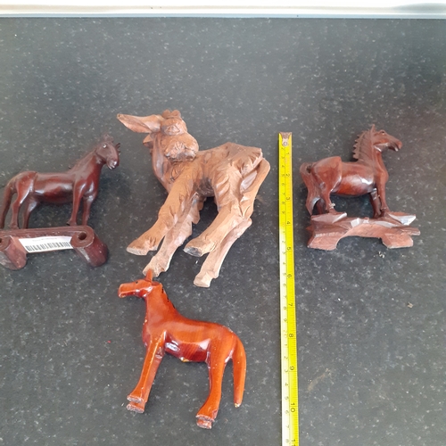 18 - 3 wooden horses and a wooden donkey. No damage.