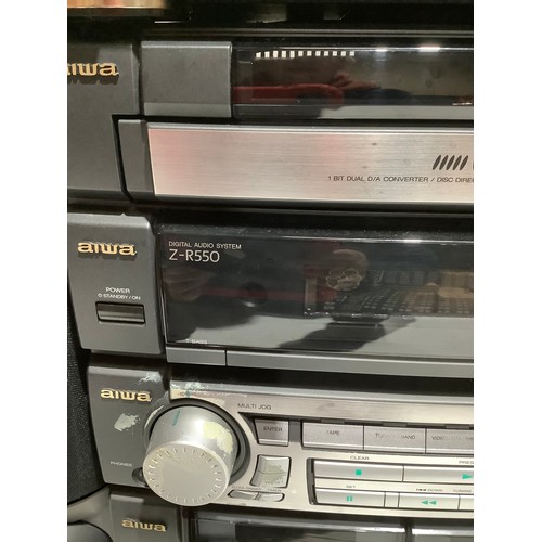 255 - Aiwa hifi stereo stacking system including 3 x CD player, twin tapes and a turntable. With speakers.