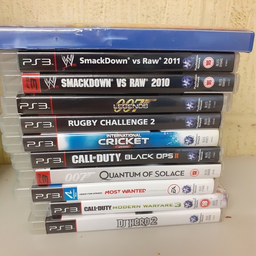 13 - A quantity of PS3 games and a PS2 game Tag force Evolution. PS3 include Smackdowm vs Raw, Call of Du... 