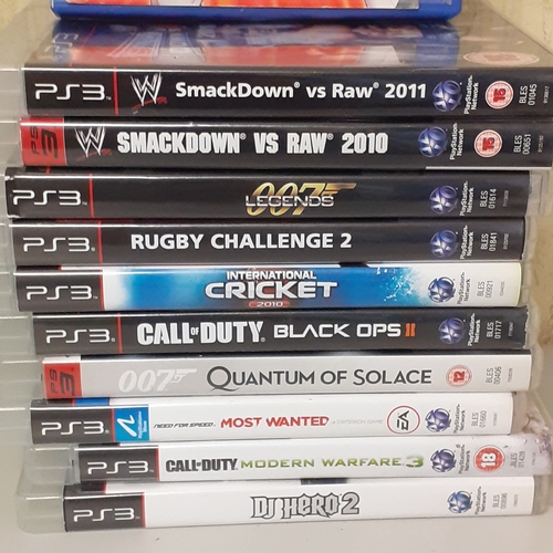 13 - A quantity of PS3 games and a PS2 game Tag force Evolution. PS3 include Smackdowm vs Raw, Call of Du... 