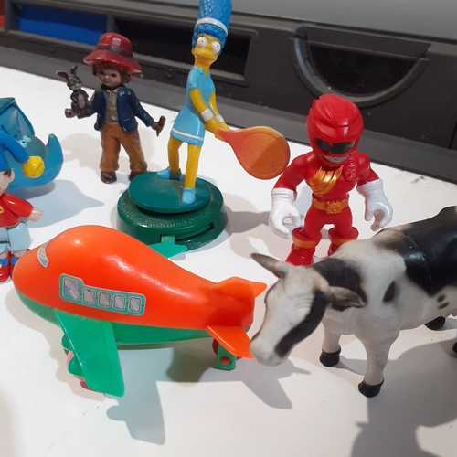 10 - A small collection of toy figures including noddy, Marge Simpson and more