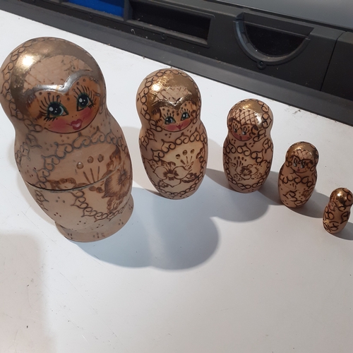 9 - Russian Dolls x 5 burnt in decoration on natural wood . Very collectable.