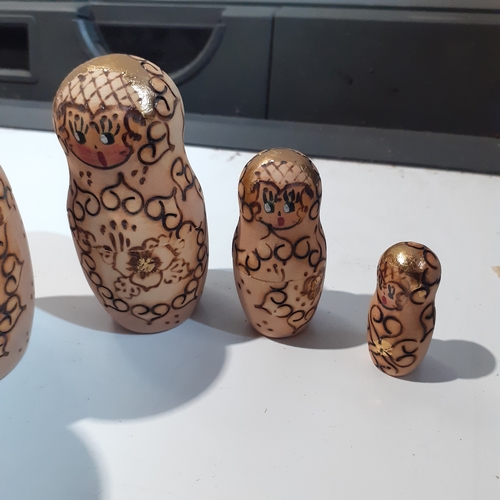 9 - Russian Dolls x 5 burnt in decoration on natural wood . Very collectable.