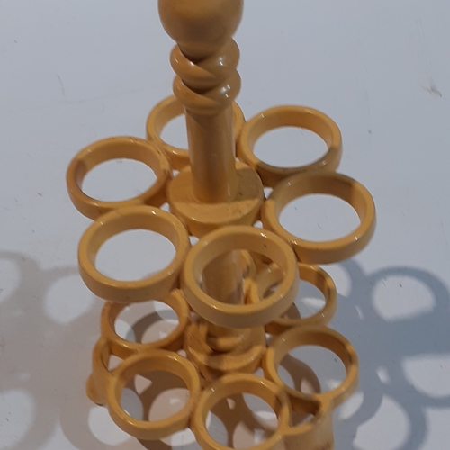 1 - Cast iron egg holder. Yellow, heavy and good condition.