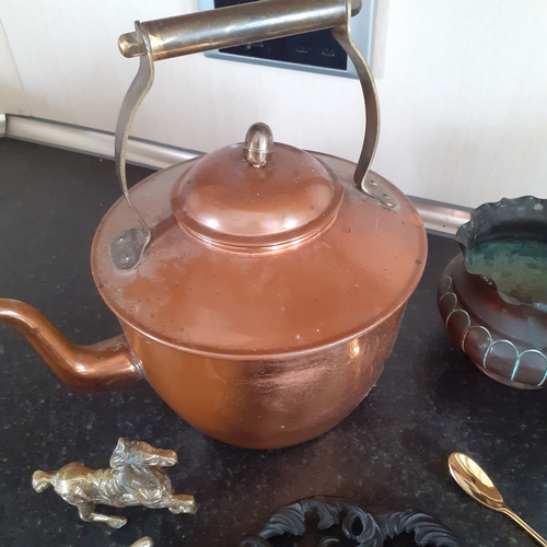 137 - A very interesting lot of metal items including brass inkwell, copper and cast iron.