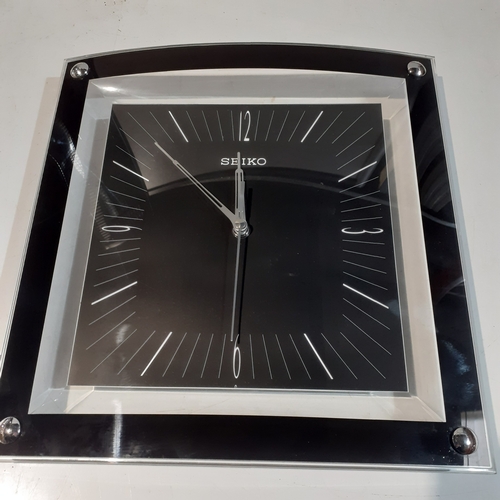 12 - Seiko Square chrome finish square wall clock in good condition and working . QXA330KN