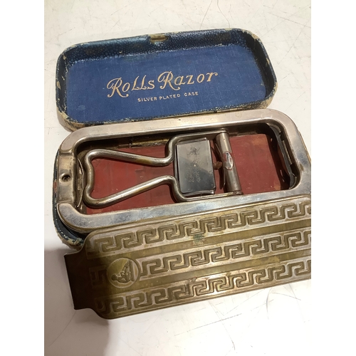 49 - Vintage silver plated rolls razor
