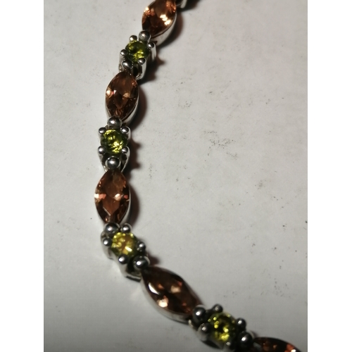 29A - Silver bracelet encrusted with green and amber gemstones 11.31 grams