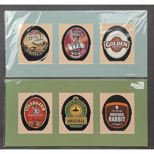 101A - 4 prints of reproduction beer pump badges. 3 prints on each. Sealed. Size: 40 cm x 19 cm.