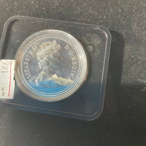 95 - 1975 Canadian dollar coin in case