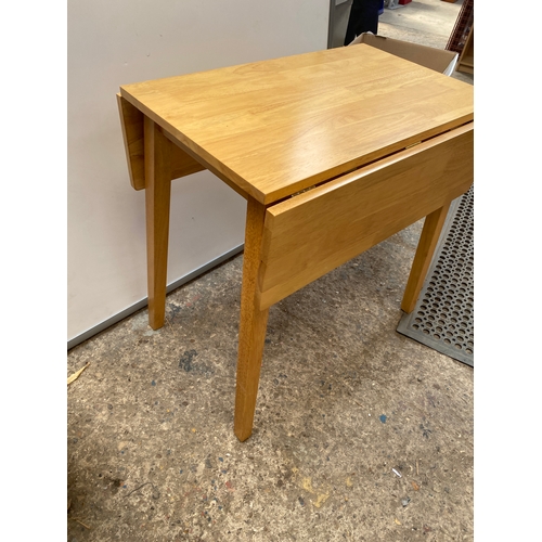 439 - Drop leaf table in clean condition - 75cm long