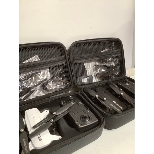 414 - 2 x Drones in cases with accessories. Sold as untested