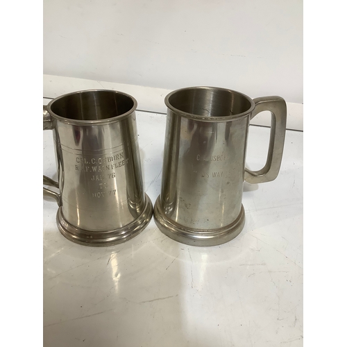 483 - Pair of silver plated tankards. One with figure of a lady designed on handle