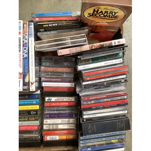 489 - Box of CDs and DVDs and cassette tapes.  Includes Mrs. Doubtfire, Miss Potter, Cliff Richard etc. CD... 