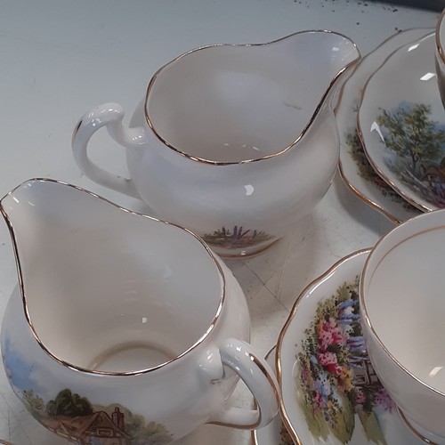 39 - Quantity of Royal Vale tea service, mainly in trios and includes teapots