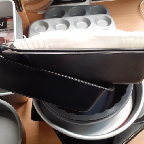 5 - Large quantityof baking/cake tins and trays. Many in new condition. Quality makes . Includes a prest... 