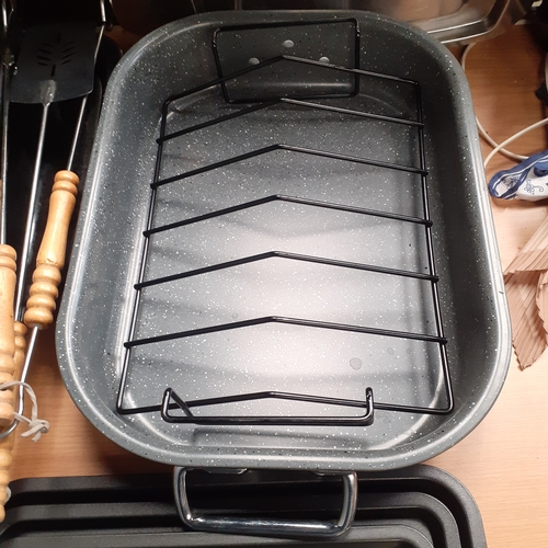 6 - Quantity of roasting tins and trays. Some brand new, never used. Included is a deep roasting tray ne... 