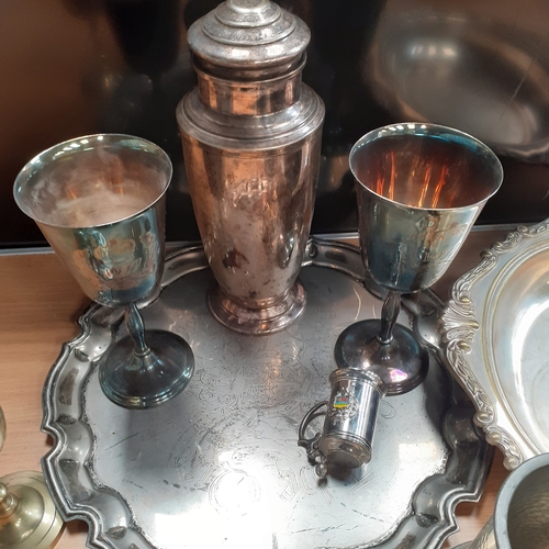 17 - A quantity of silver plate items and more, including a cocktail shaker,  goblets, a tray and more. N... 