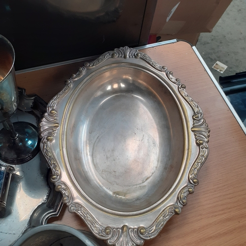 17 - A quantity of silver plate items and more, including a cocktail shaker,  goblets, a tray and more. N... 