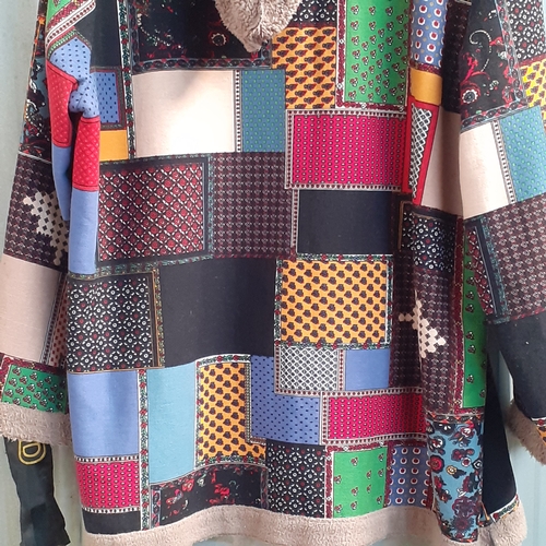 23 - Hooded patchwork material jacket. Says 4xl, doesn't look quite that big. Nice condition