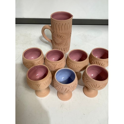 66 - painted glazed & pottery jug with 7 cups