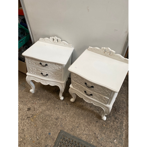 395 - Pair of white bedside furniture tables (one leg needs glueing)