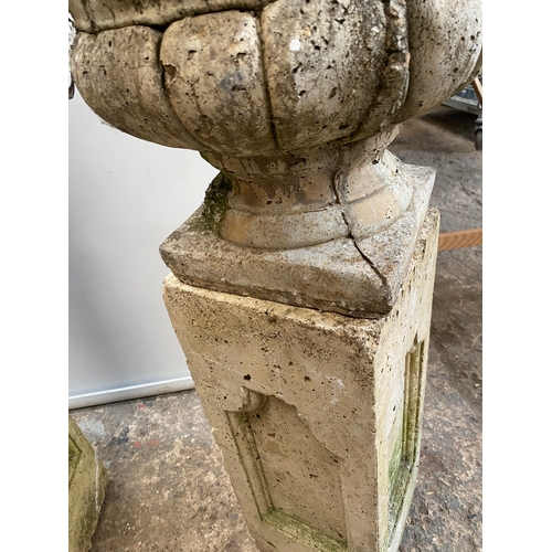 450 - Pair of heavy stone planters on rectangular plinths