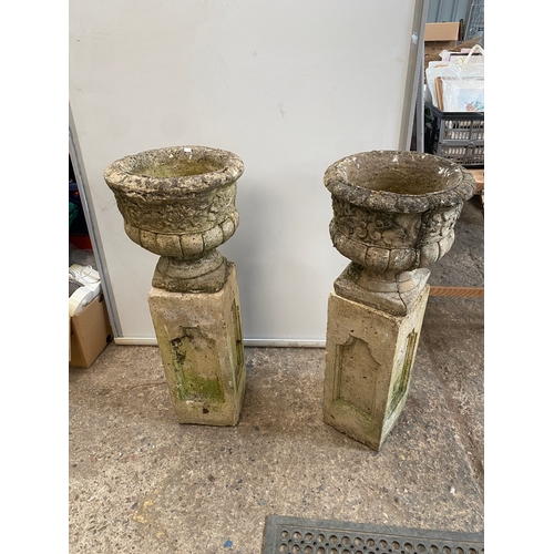 450 - Pair of heavy stone planters on rectangular plinths