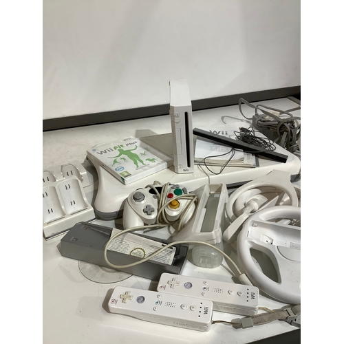 355 - Wii console wii board controllers and lots of accessories tested and working