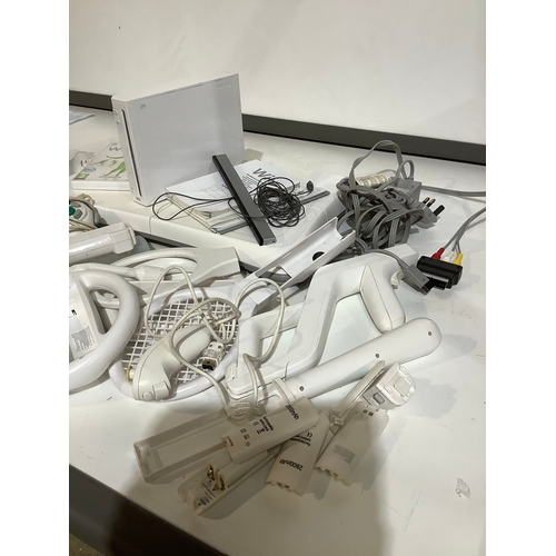 355 - Wii console wii board controllers and lots of accessories tested and working