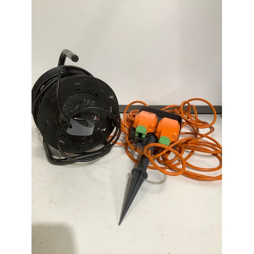 360 - Reeled extension lead plus a spiked orange double socket