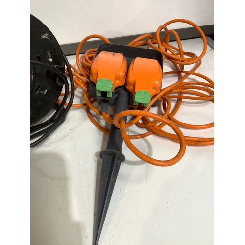 360 - Reeled extension lead plus a spiked orange double socket