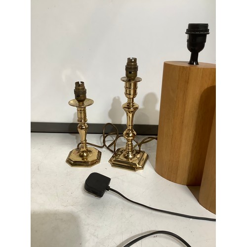 416 - A pair of heavy oak beside lights and 2 brass table lights